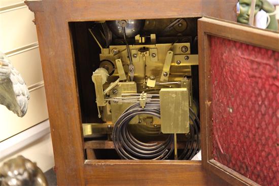 An Edwardian walnut chiming bracket clock, overall height 38in.